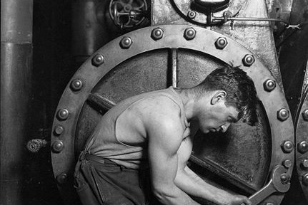431px-Lewis_Hine_Power_house_mechanic_working_on_steam_pump[1]